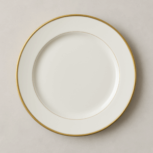 White ceramic dinner plate with a fine gold rim, ideal for upscale event rentals including weddings, galas, and private dinners—adds elegance to any table setup.