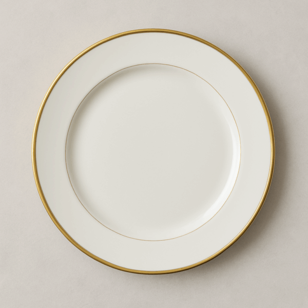 White ceramic dinner plate with a fine gold rim, ideal for upscale event rentals including weddings, galas, and private dinners—adds elegance to any table setup.