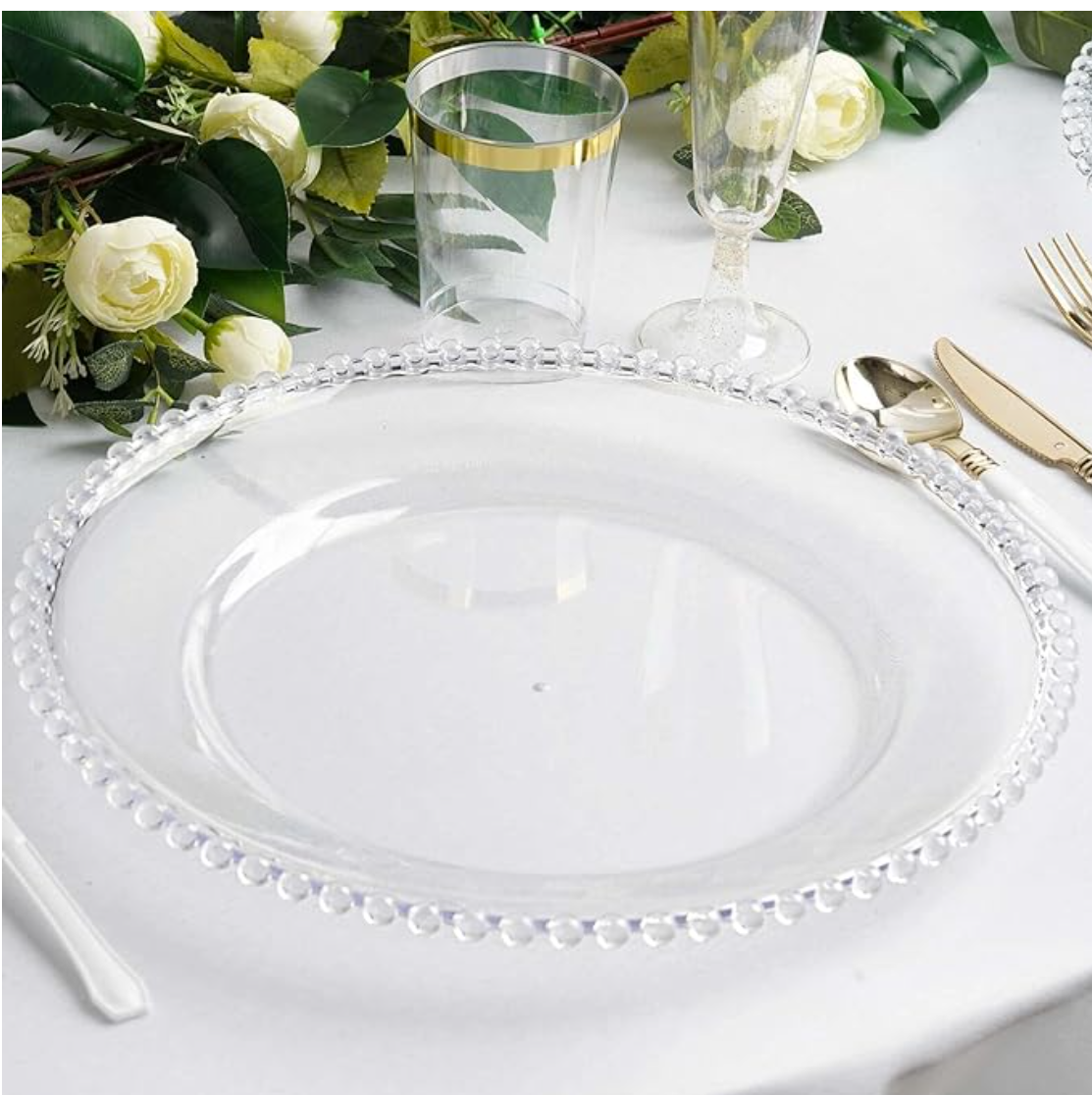 Elegant table setup featuring a clear beaded charger plate, gold flatware, Ideal for weddings, upscale dinners, and luxury events — available for rent from Houston Party Rental Services.