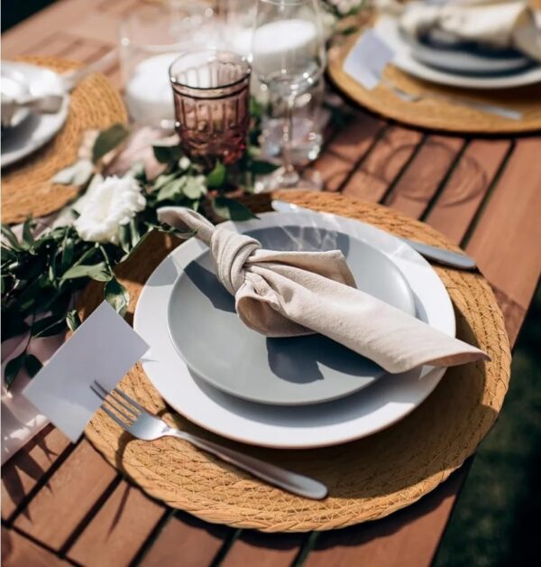 Handwoven natural fiber placemats available through Houston Party Rental Services—perfect for rustic, eco-friendly table settings at weddings, corporate events, and private parties.